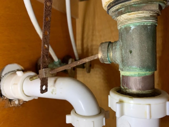 sink drain lever plug assembly in the drain piping