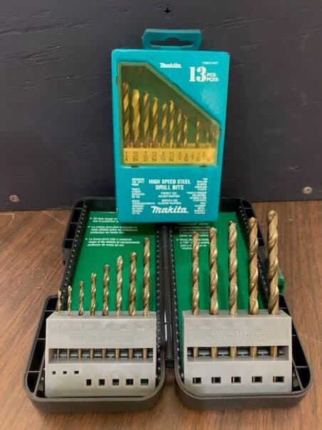 Drill bits in a carrying case on a workbench